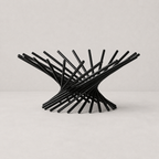 Black metal chair with a modern design on a light gray background