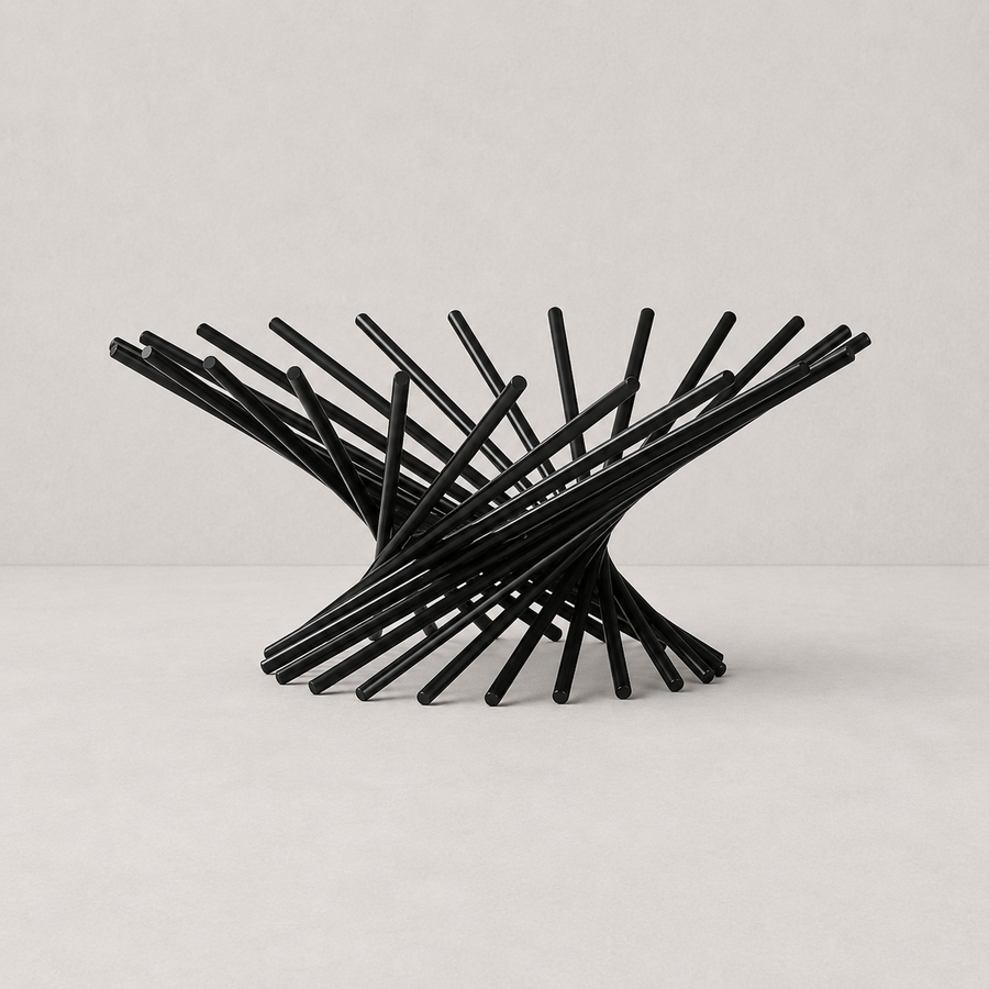 Black metal chair with a modern design on a light gray background