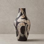 Ceramic vase with abstract design on a gray background