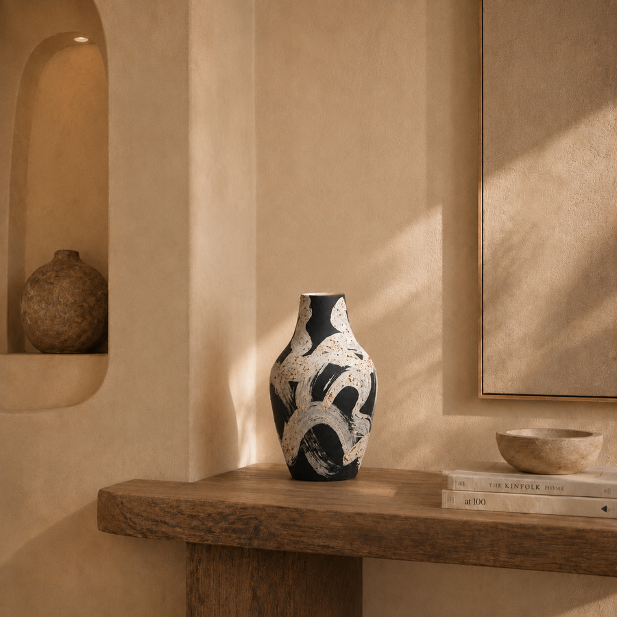 Decorative vase on a wooden shelf with a neutral background