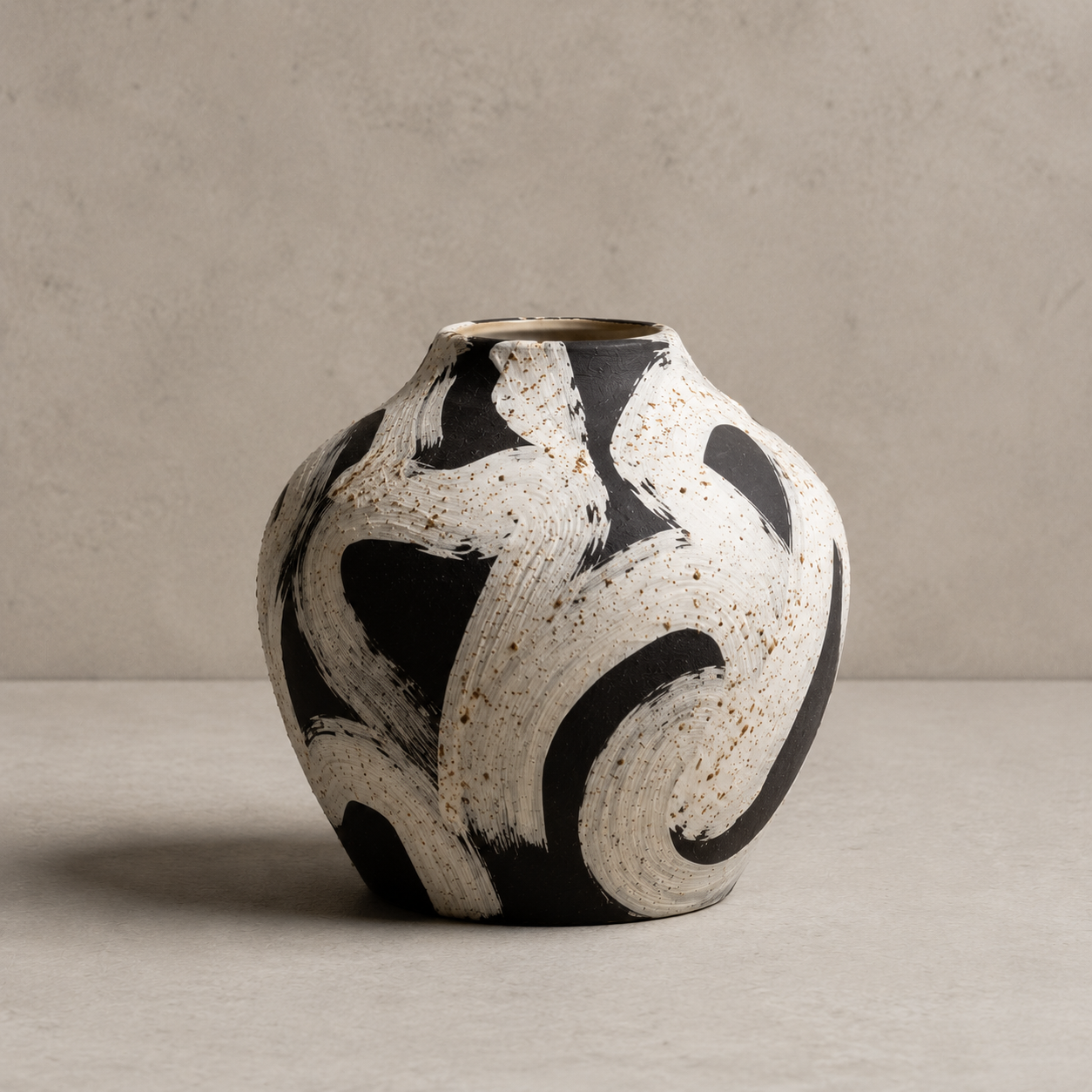 Black and white ceramic vase on a neutral background